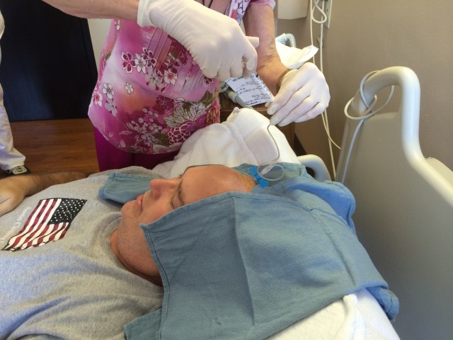 The oncologist is inserting the chemotherapy ARA-C right there. It makes an odd bubbling noise right in the middle of the brain with equal sound to both ears. Odd.